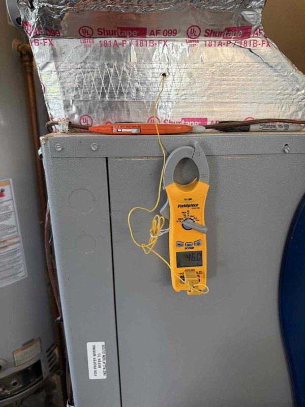 Responded to cooling complaint on geothermal system blowing warm air. Upon arrival, performed diagnostic testing of multi-zone control system and air handler unit. Utilized clamp meter to verify electrical readings and inspected HZ432 zone controller operation, checking all zone indicators, heat stages, cooling stages, and emergency heat functions. Evaluated terminal connections, wiring integrity, and control board functionality across all four zones. Assessed system operation and documented equipment conditions for proper cooling mode functionality.