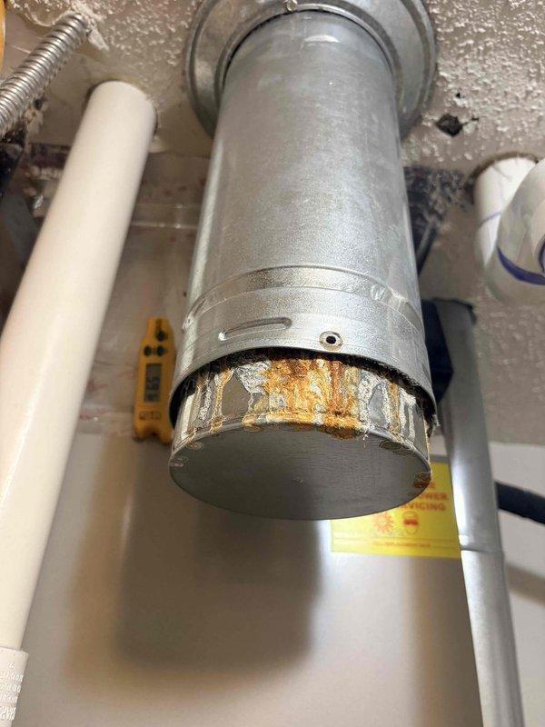 Responded to service call for malfunctioning water sensor on tanked water heater installed three years prior. Upon inspection, observed significant rust corrosion at the lower portion of the sensor assembly, indicating water exposure and component failure. Diagnosed faulty water sensor requiring replacement and provided repair quote to customer, noting unit remains under six-year tank warranty with one-year labor warranty having expired.