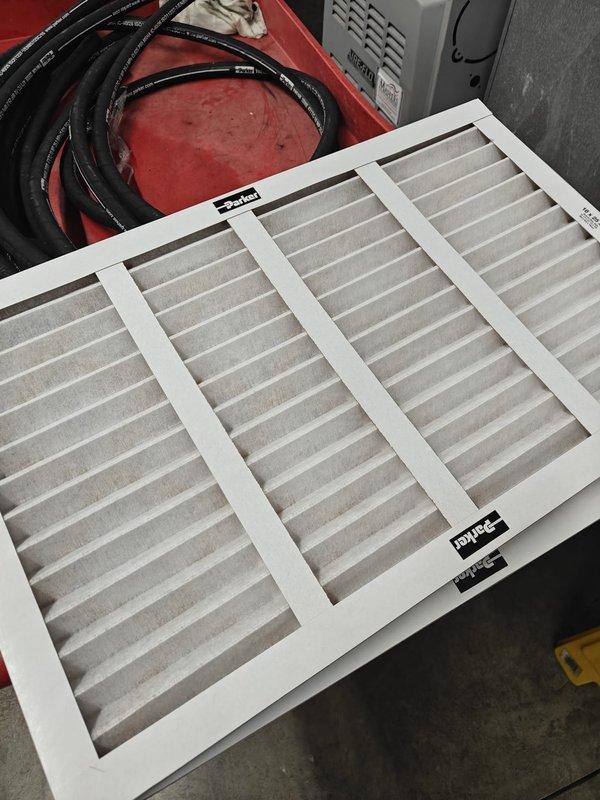 Completed scheduled commercial HVAC maintenance agreement service including filter replacement on multiple air handler units. Replaced two 16x25x1 filters and three 20x25x4 filters showing dust accumulation across all units. Inspected air handler equipment in mechanical room and attic space, verified proper mounting and ductwork connections, and confirmed all units operating within normal parameters.