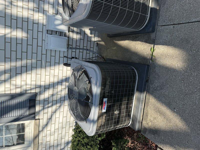 Conducted site visit to review previously provided estimate for air conditioning system and boiler replacement. Evaluated current placement of two outdoor condenser units positioned on concrete pad adjacent to building exterior and discussed relocation options with homeowner. Documented existing equipment configuration, electrical connections, and refrigerant line routing to assess feasibility of relocating AC unit to alternative location on property.