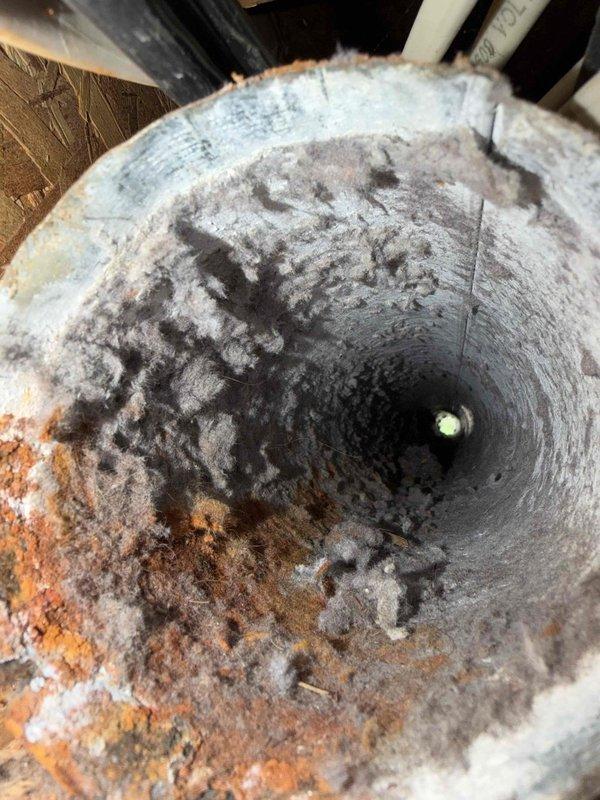 Completed dryer vent cleaning and restoration service. Removed extensive accumulation of lint, dust, and debris from interior ductwork, which showed significant contamination and rust buildup on metal surfaces. Cleaned exterior vent cover and verified proper airflow upon completion.