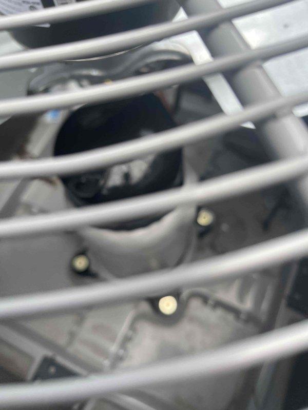 Responded to service call for warehouse air conditioning unit freezing up. Upon arrival, performed visual inspection of evaporator coil assembly and refrigerant lines. Documented condition of coil tubing, refrigerant lines, mounting brackets, and electrical connections with photographic evidence showing no visible damage or deterioration to components.