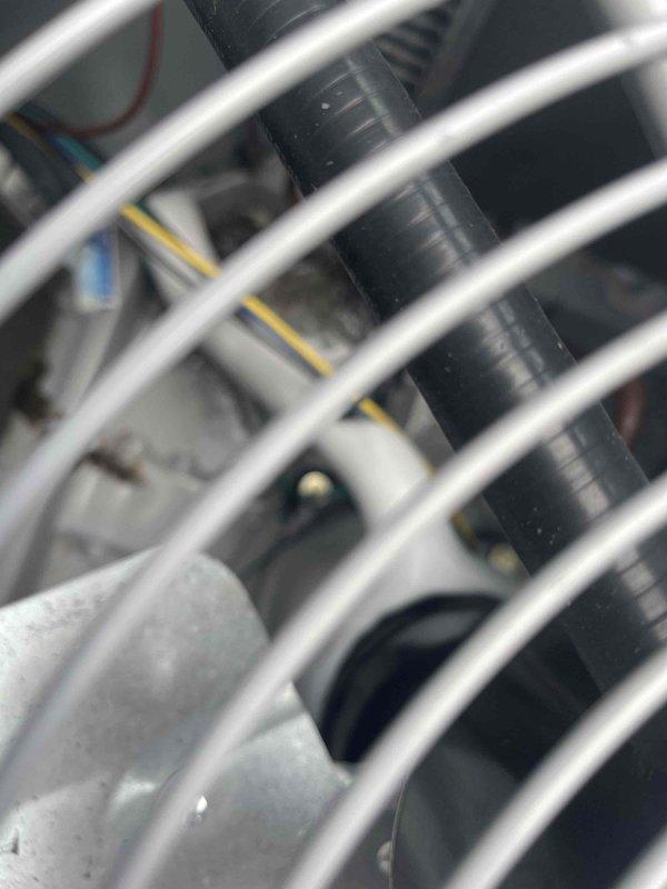 Responded to service call for warehouse air conditioning unit freezing up. Upon arrival, performed visual inspection of evaporator coil assembly and refrigerant lines. Documented condition of coil tubing, refrigerant lines, mounting brackets, and electrical connections with photographic evidence showing no visible damage or deterioration to components.