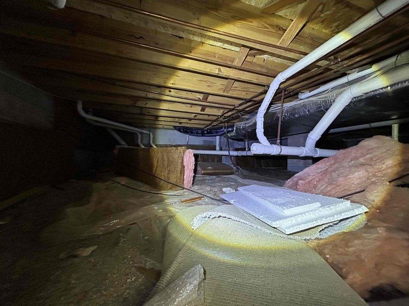 Performed site evaluation for ductless mini-split installation in master bedroom located above garage. Assessed existing attic space with exposed joists, current HVAC ductwork, and insulation conditions to determine optimal placement for indoor air handler and routing for refrigerant lines and condensate drain. Evaluated bedroom layout including vaulted ceiling architecture and electrical requirements for proposed system to provide independent climate control for the space.