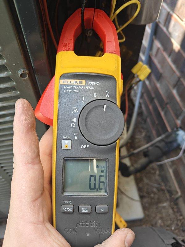 Completed air conditioning tune-up and preventative maintenance inspection. Performed electrical diagnostics using Fluke 902FC clamp meter, recording amperage draw of 0.6 amps AC, and verified voltage readings at 213V using digital multimeter. Enrolled system in maintenance plan for ongoing service coverage.