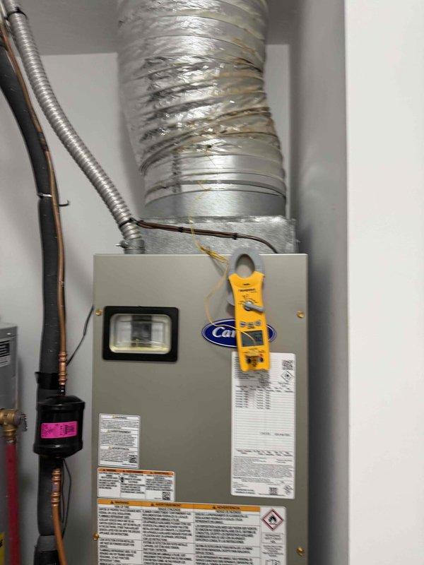 Completed system start-up and first cooling maintenance service on Carrier HVAC unit. Inspected blower wheel assembly, verified proper motor shaft connection and hardware security, and confirmed centrifugal fan operation. Checked refrigerant lines, flexible ductwork connections, and overall system integrity, documenting all components in functional condition with proper installation.