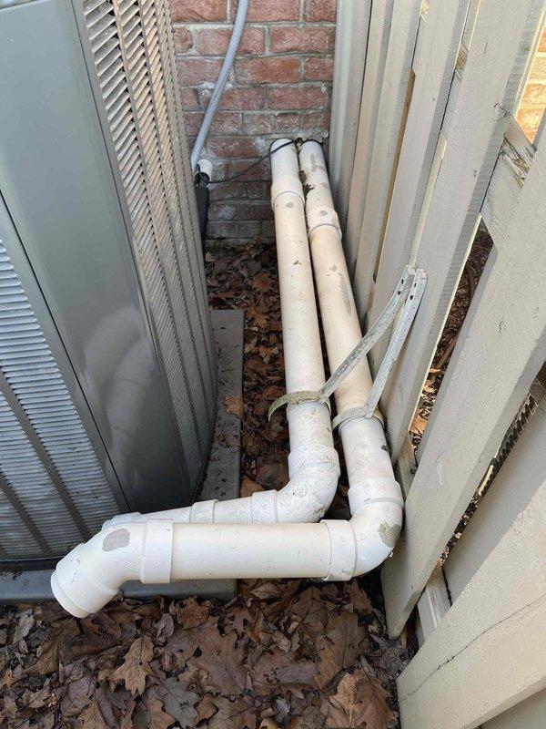 Responded to service call regarding disconnected ductwork ventilation issue. Upon arrival, inspected HVAC system and associated ductwork in basement utility area and exterior mechanical installation. Located disconnected PVC ventilation piping in crawl space area with complex configuration of drainage and ventilation components. Documented existing conditions with photographs showing PVC pipe routing through utility space alongside copper plumbing lines and HVAC infrastructure. Exterior inspection revealed condensate drainage system with U-trap configuration running between HVAC unit and building exterior. Advised property owner and contractor present on-site of findings and recommended proper reconnection of ventilation ductwork to ensure system operates according to manufacturer specifications and code requirements.