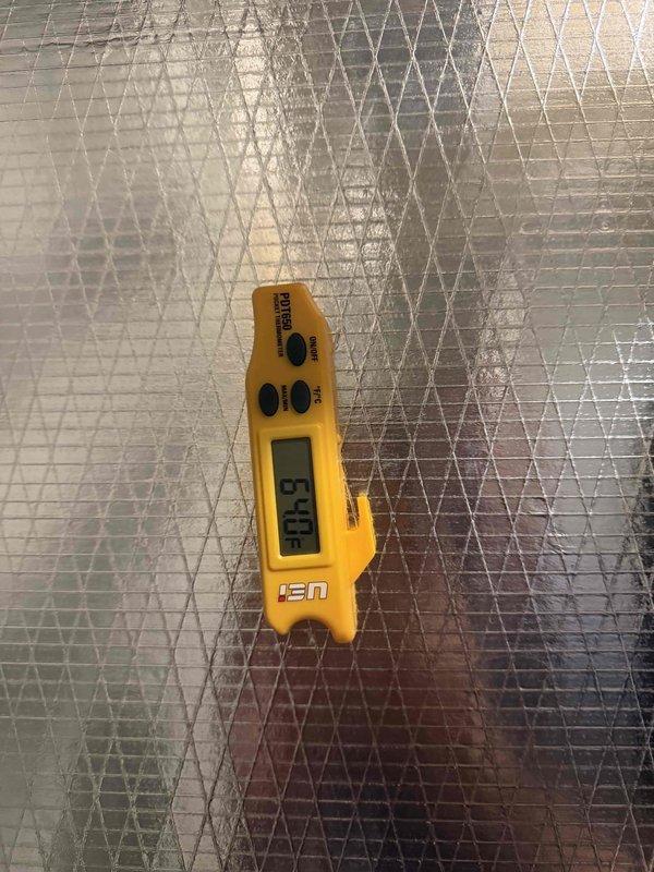 Responded to cooling complaint on recently installed system not reaching thermostat setpoint. Performed diagnostic temperature measurements at supply register, which confirmed inadequate airflow or cooling performance with supply air temperature reading 38.5°F. Documented equipment conditions and temperature readings for warranty processing and further evaluation of system performance issue.
