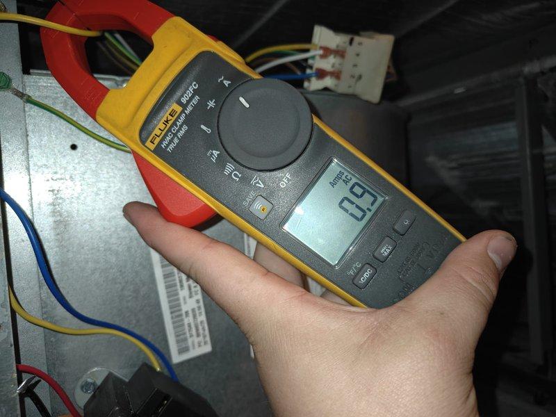 Completed routine cooling maintenance on residential air conditioning system. Inspected condenser unit coil fins, which were found to be clean and in good condition with proper airflow through protective grille. Performed electrical diagnostics using clamp meter to verify system amperage draw of 0.2 amps, checked wire connections at control panel, and confirmed all electrical components were functioning within normal operating parameters.