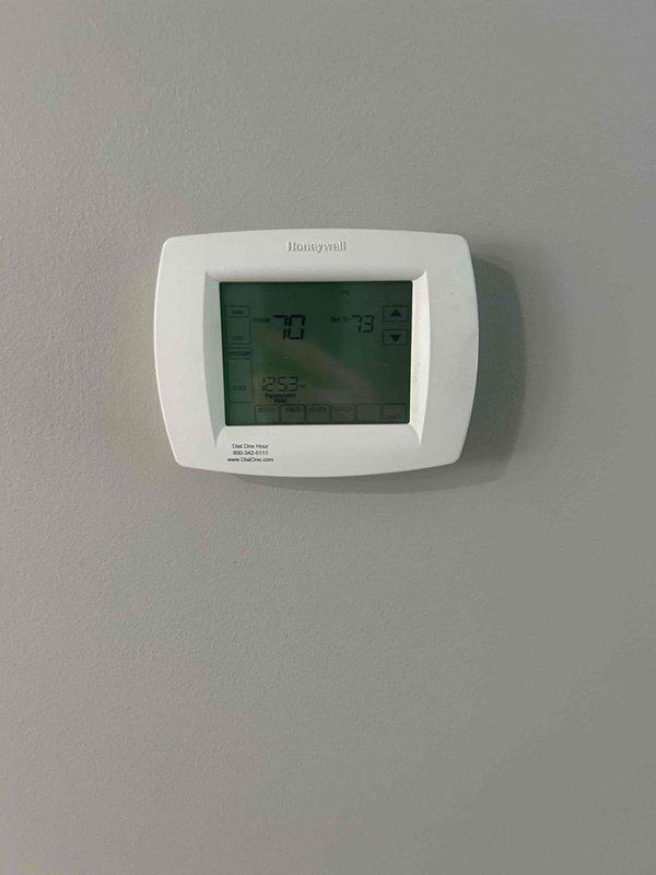 Completed comprehensive estimate for full HVAC system replacement on 16-year-old existing equipment. Evaluated current Honeywell programmable thermostat and assessed crawl space installation including existing ductwork, insulation, and ventilation components. Documented system configuration with pink fiberglass insulation between joists, PVC plumbing infrastructure, metallic reflective duct insulation, and crawl space ventilation fan. Provided replacement recommendations based on current system age and condition assessment.