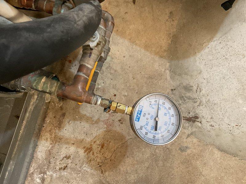 Completed maintenance tune-up on HVAC system. Performed system diagnostics using digital testing equipment, checked system pressures and temperatures at boiler connections, and inspected copper piping and valve assemblies. Noted visible corrosion and oxidation on copper lines; system operating within acceptable parameters at time of service.