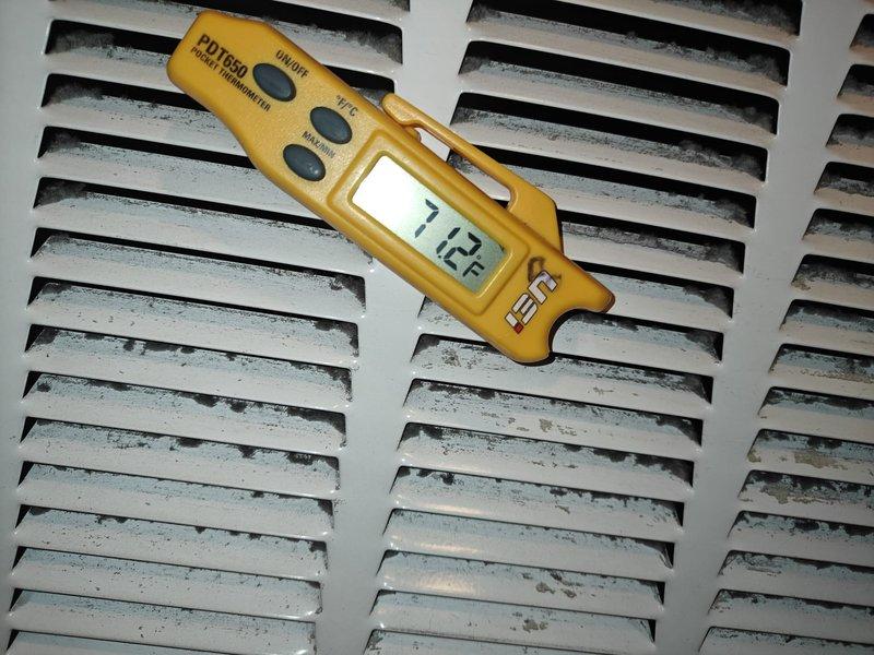 Completed AC tune-up maintenance on residential air conditioning system. Performed airflow measurement at supply register recording 112 CFM and verified supply air temperature at 33.8°F, indicating proper system cooling performance. Noted accumulated dust and debris on ventilation grill requiring routine cleaning to maintain optimal airflow efficiency.