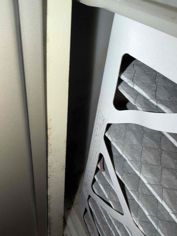 Completed new system start-up and first cooling maintenance service for 2026 season. Inspected HVAC system components including air handler unit and filtration system. Documented pleated air filters installed in furnace assembly, noting standard accordion-style filters with cardboard frames featuring diagonal cross-bracing design. Filters showed normal dust accumulation consistent with operational system. Verified proper filter installation and positioning within metal housing. Observed minor dirt and dust streaks on filter frame edges, typical for systems in active service. Confirmed adequate air filtration media condition with gray pleated construction providing appropriate surface area for particle capture. System operational and ready for cooling season.