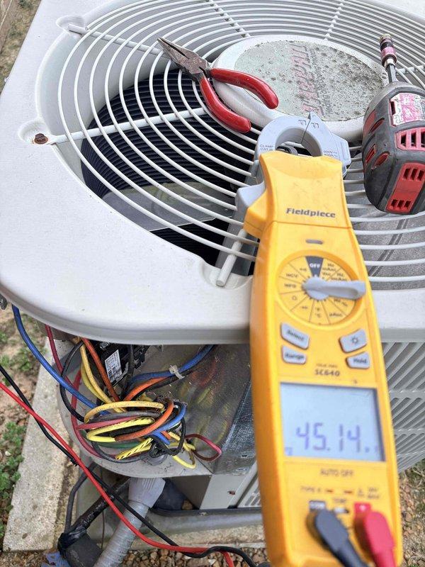 Completed preventive maintenance on outdoor condensing unit. Performed electrical diagnostics using digital multimeter, tested capacitor functionality and verified proper voltage readings across all electrical connections. Inspected wiring harness and terminal connections, confirmed all wire connections secure and within manufacturer specifications.