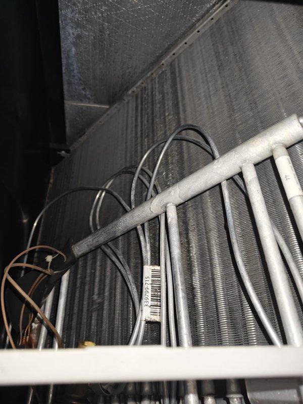 Completed comprehensive AC tune-up on residential air conditioning system. Inspected evaporator coil assembly and noted moderate dust accumulation on heat exchanger fins; verified refrigerant lines and electrical connections throughout air handler. Measured system amperage draw at 0.08 amps using clamp meter at outdoor condensing unit, confirming electrical performance within manufacturer specifications.