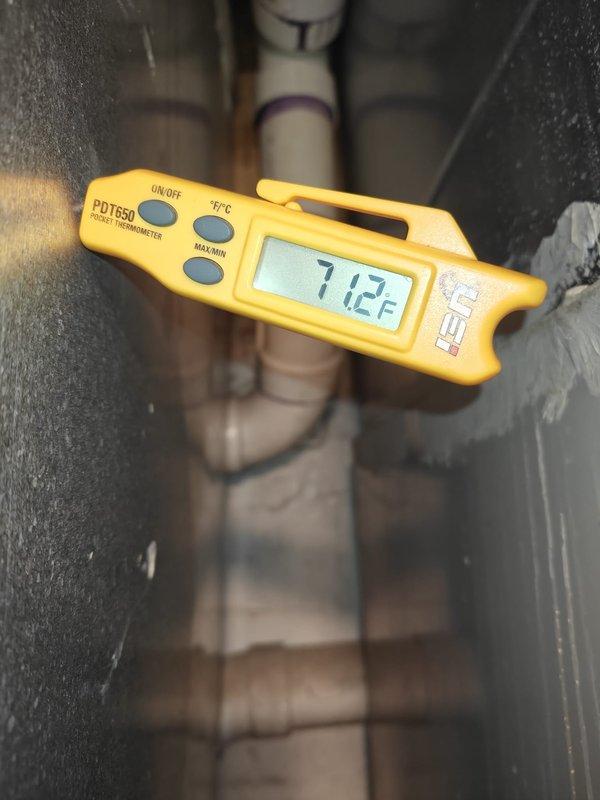 Completed 2026 cooling maintenance service on residential HVAC system. Inspected air handler unit in attic space, noting heavily soiled pleated air filter with significant dust accumulation requiring replacement. Verified system airflow and recorded supply air temperature of 71.2°F using calibrated digital thermometer. Inspected ductwork, refrigerant lines, and mechanical components for proper operation and wear. System operating within normal parameters following routine maintenance procedures.