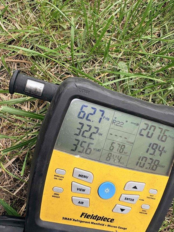 Performed complete system tune-up on residential air conditioning unit, including refrigerant pressure and temperature diagnostics using digital manifold gauge. Verified superheat at 322°F and saturated vapor temperature at 356°F with system pressures reading 627 PSIG. Inspected condenser fan assembly, confirmed proper operation of fan motor and blades, and documented unit condition with all components functioning within normal parameters.