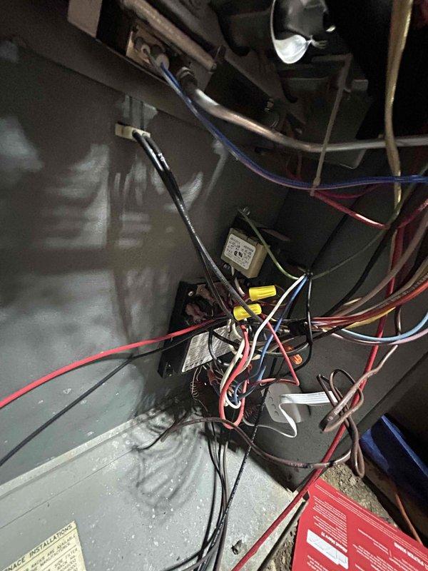 Completed full system replacement estimate for existing HVAC installation. Documented current equipment configuration including furnace control cabinet wiring, Aprilaire humidifier integration with ductwork system, and overall mechanical layout in attic space. Photographed existing electrical connections, relay components, and duct arrangement to provide comprehensive assessment for complete system replacement proposal.
