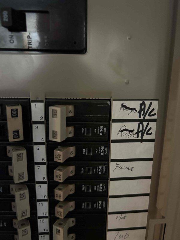 Completed HVAC system replacement estimate for residential property. Assessed existing electrical panel configuration with dedicated circuits for rooms A/C, furnace, and hot tub to verify compatibility with replacement equipment. Evaluated current Trane thermostat functionality and documented system operating at 69°F setpoint for replacement planning specifications.