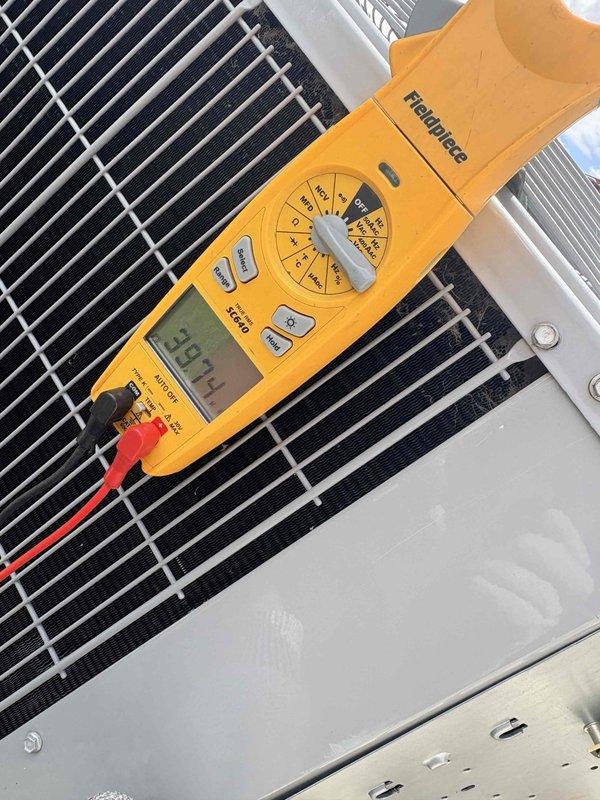 Completed comprehensive cooling maintenance on two HVAC systems. Performed standard preventive maintenance procedures including inspection of outdoor condensing units, verification of electrical parameters with multimeter readings showing 394 volts, and temperature measurements confirming supply air at 83°F. All components inspected, cleaned, and verified operational; both systems tested and left in proper working condition.