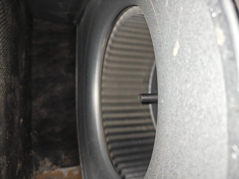 Completed air conditioning tune-up service including comprehensive system inspection and maintenance. Inspected evaporator coil and noted moderate dust accumulation on fins; inspected blower wheel assembly and housing, confirming proper condition and operation. All components found operational with routine wear consistent with normal use.