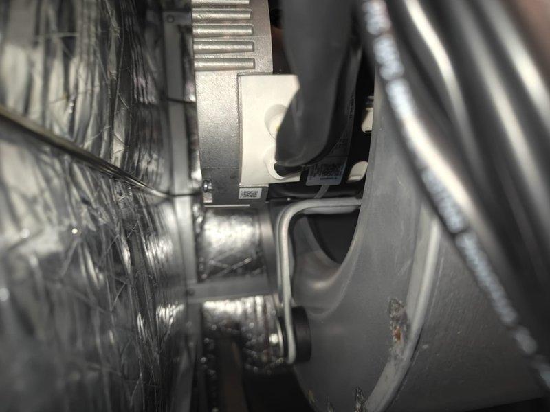 Completed comprehensive cooling system maintenance inspection on residential HVAC unit. Performed standard preventive maintenance procedures including inspection of outdoor condenser unit, which showed moderate accumulation of dirt and debris on coils requiring attention. Inspected interior ductwork components and connections in attic space, verifying proper installation and integrity of flexible and rigid duct sections with all mounting hardware secure and operational.