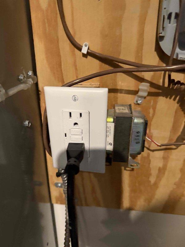 Responded to no cooling call where unit was displaying error codes at both the equipment and thermostat. Upon arrival, found zone damper control system showing "ZONING DISABLED" status with notification to check main control for details. Inspected zone damper control board, associated transformers, and low-voltage wiring connections throughout the system. Documented electrical panel configuration including GFCI outlet, dual transformers, and multi-zone wiring terminations to identify source of communication failure between zoning system and HVAC equipment.