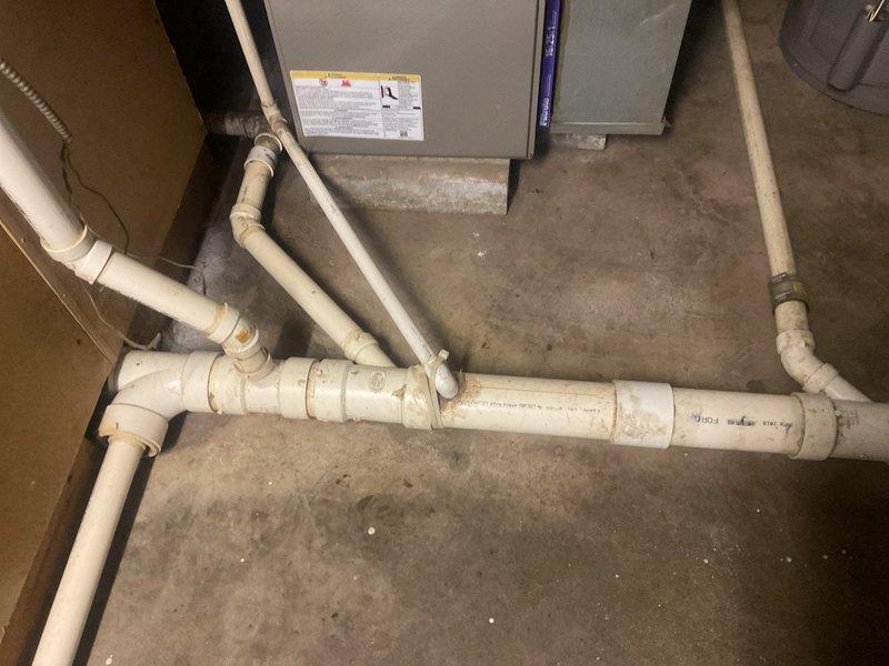 Conducted on-site evaluation of existing residential HVAC system for complete air conditioning replacement estimate. Assessed outdoor condenser unit showing significant age-related deterioration, weathering, and reduced efficiency, along with indoor air handler and associated refrigerant lines and condensate drainage system. Provided comprehensive replacement options and specifications for new cooling system installation.