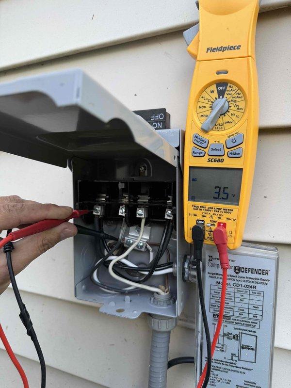 Responded to no heat call on recently installed HVAC system. Upon arrival, verified thermostat calling for heat but indoor temperature not reaching setpoint of 73°, remaining at 71°. Performed voltage testing at outdoor unit disconnect using multimeter, confirming 35 volts present at condenser unit terminals. Inspected furnace control board and identified fault condition indicated by LED diagnostic code display showing "88". Determined control board failure preventing proper system operation. Issue resolved and heating system restored to normal operation.