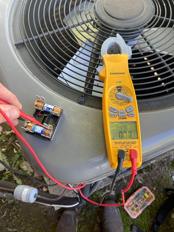 Performed comprehensive diagnostic evaluation of outdoor air conditioning condenser unit to provide full system replacement estimate. Utilized Fieldpiece SC680 clamp meter to measure electrical parameters including voltage, amperage, and capacitance values at the capacitor and electrical components. Tested system performance, inspected fan motor assembly, and evaluated overall unit condition to determine replacement specifications and requirements.