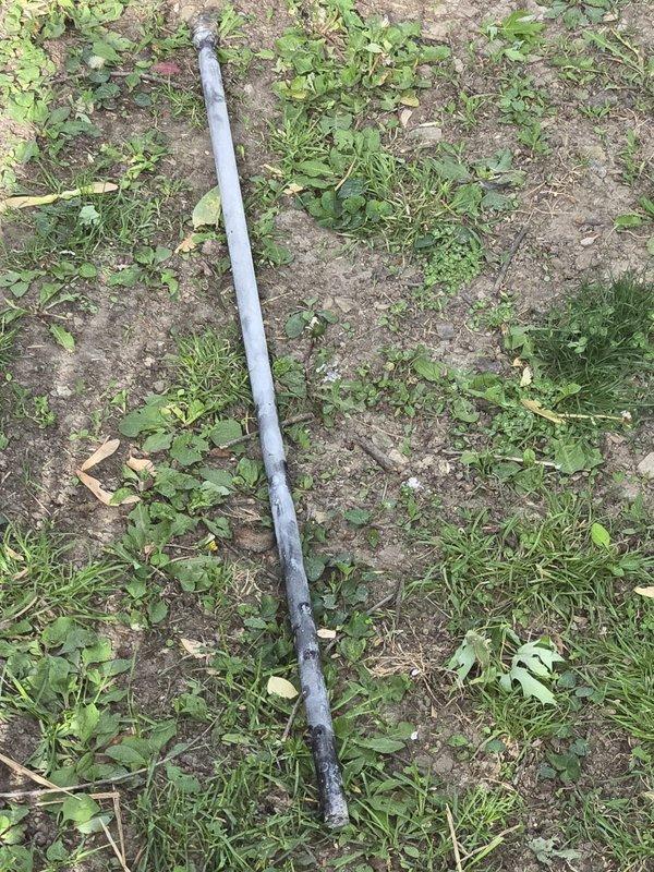 Replaced deteriorated anode rod with customer-supplied flexible anode rod and performed complete water heater flush to remove sediment buildup and restore system efficiency. Old anode rod showed significant corrosion and deterioration, indicating proper replacement timing to protect tank integrity.