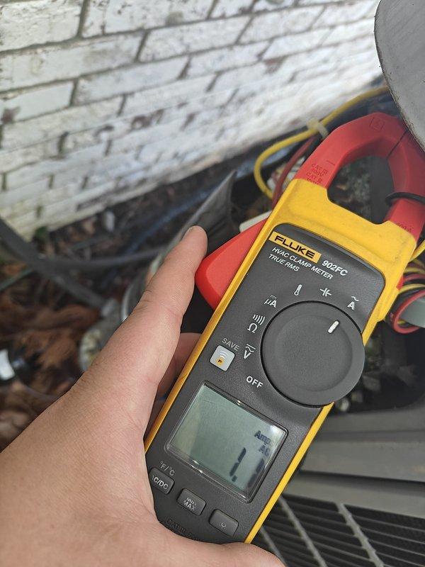 Completed scheduled cooling maintenance on residential air conditioning system. Performed electrical diagnostics using clamp meter, recording compressor amperage at 8.6 amps and additional circuit measurement at 1.7 amps, confirming all electrical components operating within normal parameters. Inspected outdoor condensing unit, verified proper wire connections, and assessed refrigerant lines and insulation condition with no issues found.