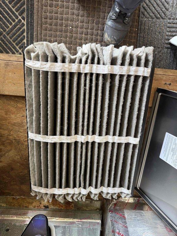 Completed scheduled cooling maintenance on Carrier HVAC system. Replaced heavily soiled air filter that showed significant dust and debris accumulation throughout pleated media, which was restricting airflow and reducing system efficiency. Inspected furnace unit, air handler, ductwork connections, and condensate drain lines; all components found in proper working condition with no immediate service needs identified.