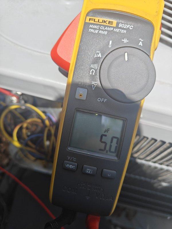 Completed comprehensive cooling maintenance inspection on residential HVAC system. Verified supply air temperature at register measuring 54.0°F, confirming proper cooling operation. Tested capacitor using clamp meter, reading 5.0 μF within acceptable range, indicating electrical components functioning correctly and system operating as designed.