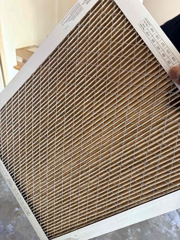 Completed comprehensive AC tune-up and preventative maintenance inspection on residential cooling system. Replaced pleated air filter with new clean filter to ensure proper airflow and system efficiency. Inspected condenser unit fan assembly, fan guard, and motor mount; verified all components in good working condition with no visible damage or wear.
