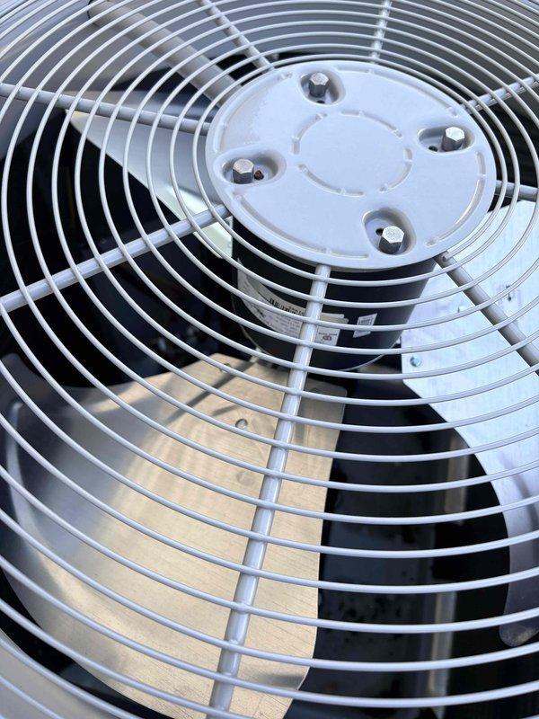 Completed comprehensive AC tune-up and preventative maintenance inspection on residential cooling system. Replaced pleated air filter with new clean filter to ensure proper airflow and system efficiency. Inspected condenser unit fan assembly, fan guard, and motor mount; verified all components in good working condition with no visible damage or wear.