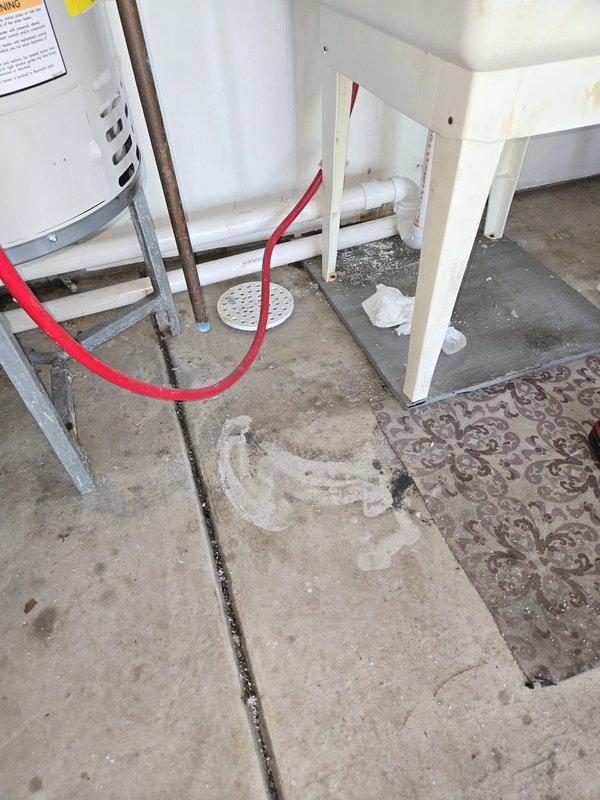 Installed new water softener system with digital control head and brine tank in utility room, connecting all necessary water supply lines and drain connections. Upgraded existing laundry sink drain line from current size to 1-1/2 inch PVC, routing it properly to the floor drain to accommodate increased water discharge from the new softener system during regeneration cycles.