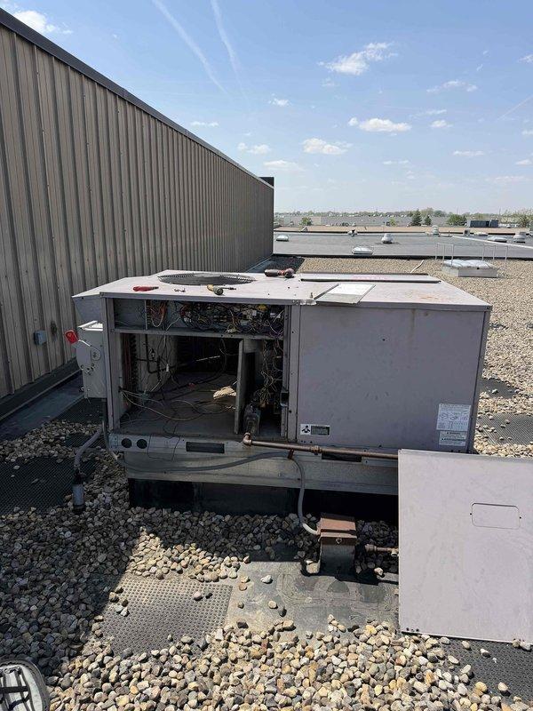 Responded to no heat or AC call at commercial complex. Performed complete diagnostic on rooftop packaged HVAC unit. Upon inspection, found severely corroded electrical panel and junction box with deteriorated wiring connections. Multiple wire insulation failures noted with exposed copper conductors present. Terminal blocks showed significant rust and corrosion affecting electrical continuity. Internal unit components accessed for full system evaluation. Documented existing conditions with photos for repair quote submission. Unit requires electrical panel replacement, rewiring of corroded connections, and assessment of additional mechanical components before system can be safely restored to operation.
