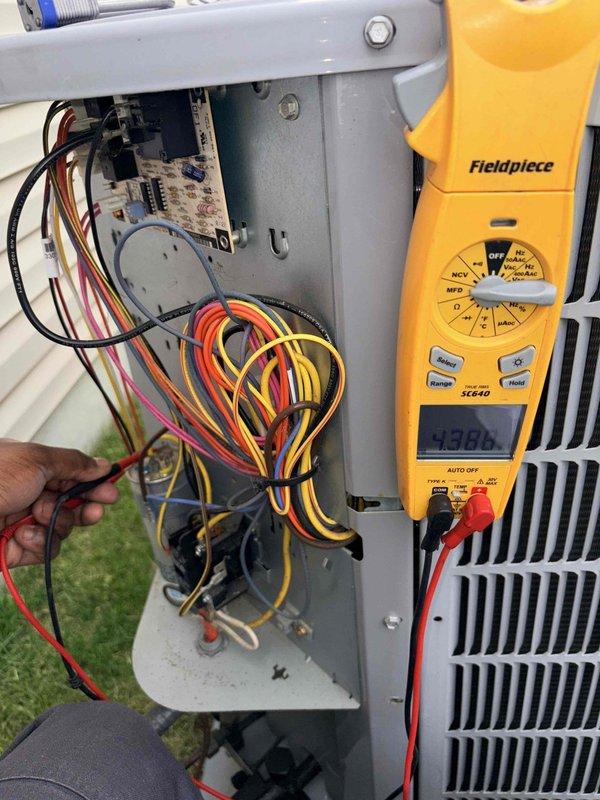 Performed monthly cooling maintenance on outdoor condensing unit. Conducted electrical diagnostics using multimeter, recording voltage reading of 438.0V at control board and 384.7V at compressor circuit. Inspected all electrical connections, control board wiring, and verified proper amperage draw using clamp meter. System operating within normal parameters; all components functioning as designed.