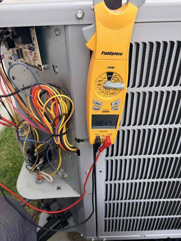 Performed monthly cooling maintenance on outdoor condensing unit. Conducted electrical diagnostics using multimeter, recording voltage reading of 438.0V at control board and 384.7V at compressor circuit. Inspected all electrical connections, control board wiring, and verified proper amperage draw using clamp meter. System operating within normal parameters; all components functioning as designed.