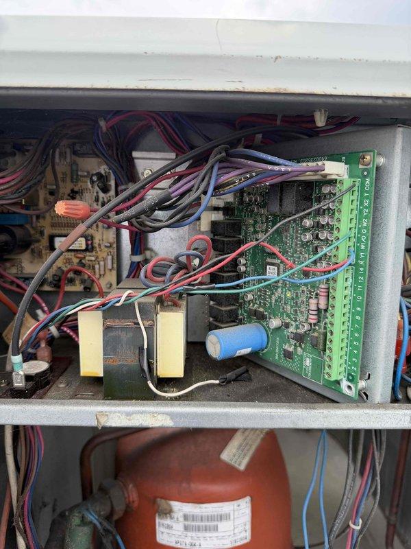 Responded to no cooling complaint affecting entire three-story general office complex with two non-operational HVAC units. Upon arrival, inspected both units and discovered electrical power had been disconnected to the systems. Examined control panels, circuit boards, transformers, and associated wiring harnesses for both units to verify system integrity. Inspected refrigerant line insulation and mechanical components for signs of damage or deterioration. Confirmed units required electrical service restoration before operational testing could be completed. Documented existing conditions including control board configuration and piping infrastructure. Advised site contact that electrical contractor would need to restore power before HVAC systems could be energized and further diagnostics performed.