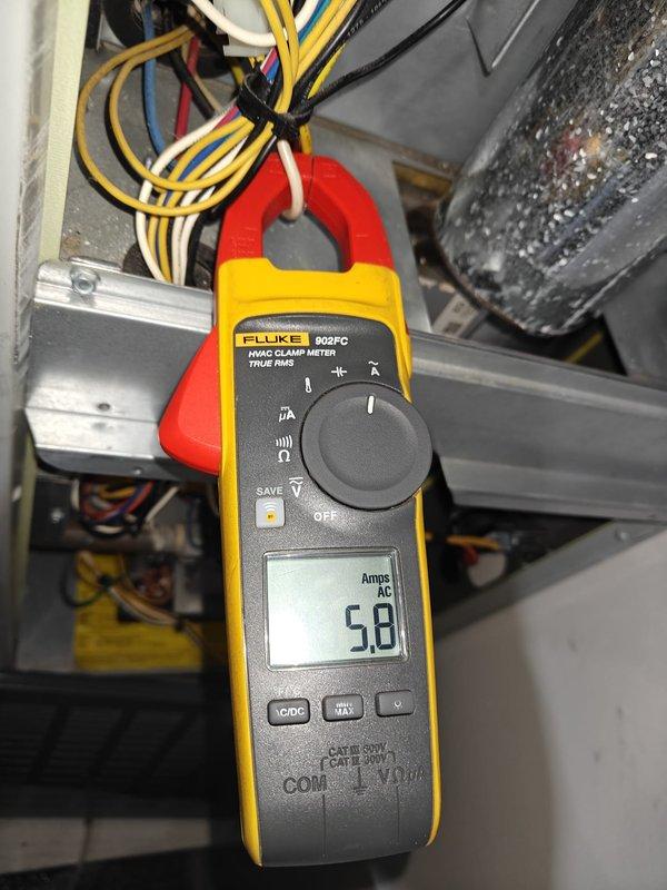 Completed comprehensive AC tune-up including electrical diagnostics and capacitor testing. Measured blower motor current draw at 5.8 amps AC and tested run capacitor reading 29.6 microfarads, both within normal operating parameters. All system components inspected and operating efficiently.