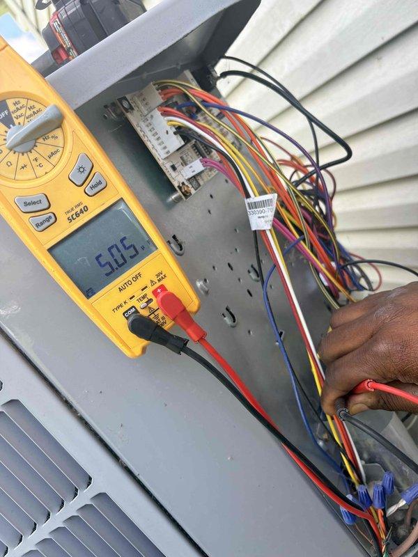 Completed scheduled cooling maintenance on residential air conditioning unit. Performed comprehensive electrical diagnostics including voltage measurements at outdoor unit junction box, verifying proper electrical supply and connections. Inspected and tested capacitor and associated wiring harness, confirming all terminal connections secure and electrical components operating within manufacturer specifications. System tested and operating properly.