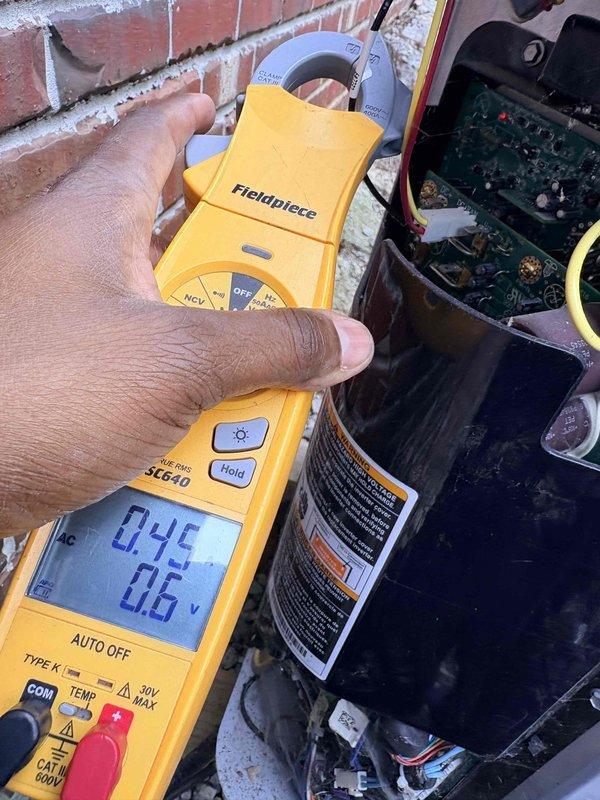 Completed comprehensive cooling maintenance on residential HVAC system. Performed electrical diagnostics using clamp meter, recording voltage readings of 24.5A and 0.6V at control board to verify proper system operation. Inspected transformer, wiring connections, and electrical components within unit enclosure, confirming all connections secure and system operating within normal parameters.
