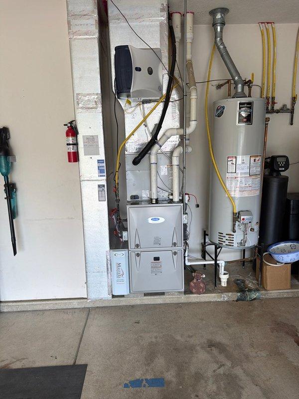 Responded to warranty service call for one-year-old HVAC system with reported lack of temperature change. Upon arrival, performed comprehensive system diagnostics on garage-installed furnace and air handler unit. Conducted pressure testing using nitrogen test equipment to verify refrigerant charge levels and identify potential leaks in the system. Measurements indicated system pressures were outside normal operating parameters. Inspected all refrigerant lines, connections, and components for leaks or damage. Verified proper electrical connections and control wiring integrity throughout the system. Checked condensate drain lines and PVC piping for proper drainage and blockages. System restored to proper operating condition with correct refrigerant pressures established and all components functioning within manufacturer specifications.