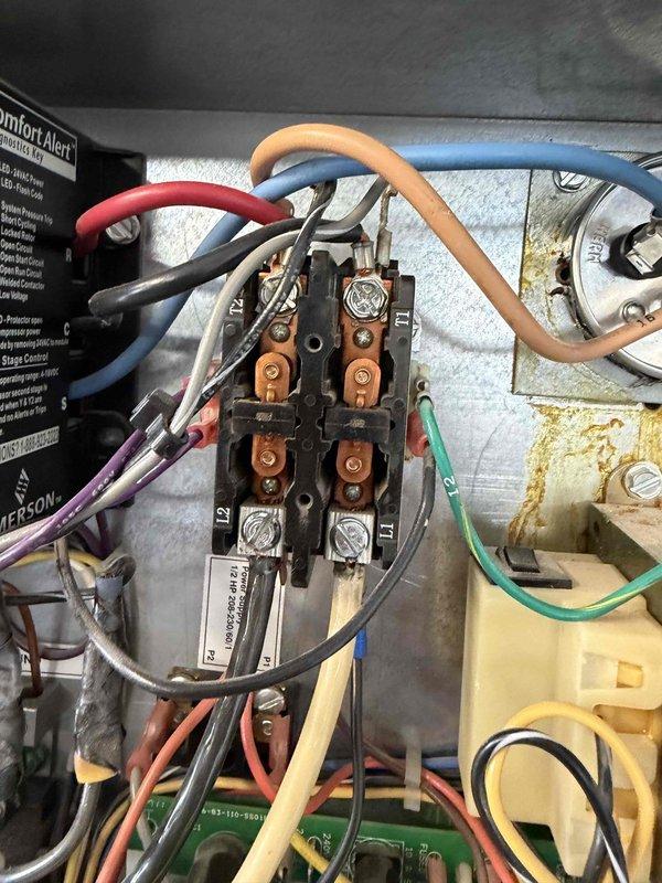 Performed comprehensive HVAC system tune-up and maintenance inspection. Conducted electrical diagnostics using calibrated clamp meter to verify proper amperage draw and system performance. Inspected all electrical connections at terminal block, confirmed secure wire terminations, and verified proper operation of all system components including Comfort Alert safety controls.