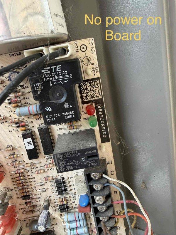 Returned to diagnose Lennox heat pump system per customer request for follow-up evaluation. Upon inspection, identified failed control board with no power present. Verified thermostat was calling for cooling with system set to 58 degrees while inside temperature read 65 degrees, confirming communication attempt from thermostat. Tested electrical supply to control board and confirmed complete board failure with no LED indicators illuminated and no relay operation. Documented failed control board condition with photographic evidence showing TE and Omron relays, capacitors, and other board components. Presented repair options to customer for control board replacement to restore heat pump operation.