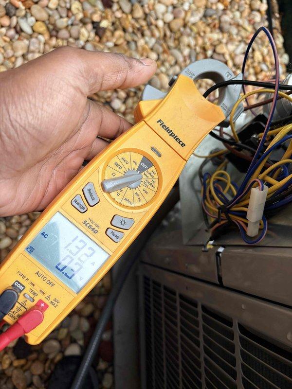 Completed scheduled cooling maintenance on outdoor condensing unit. Performed electrical diagnostics using digital multimeter, recording compressor amperage draw of 4.254 amps and system voltage reading of 433 volts. Inspected capacitor, wiring connections, and condenser coil condition, confirming all components operating within normal parameters.