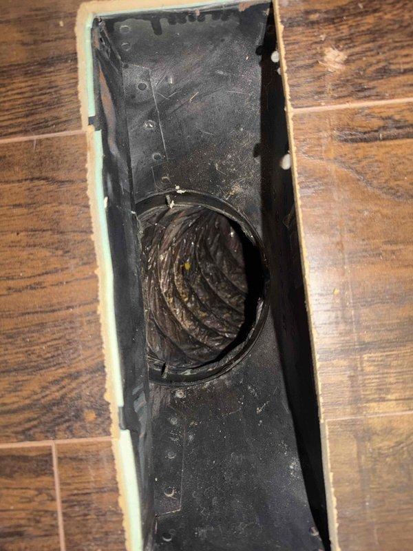 Responded to complaint of inadequate airflow to back room. Inspected floor register and traced flexible ductwork through attic space. Found disconnected and unsealed duct joints causing significant air loss before reaching the affected room. Reattached and sealed all ductwork connections with mastic and foil tape to restore proper airflow. Verified system operation and confirmed improved air delivery to back room upon completion.