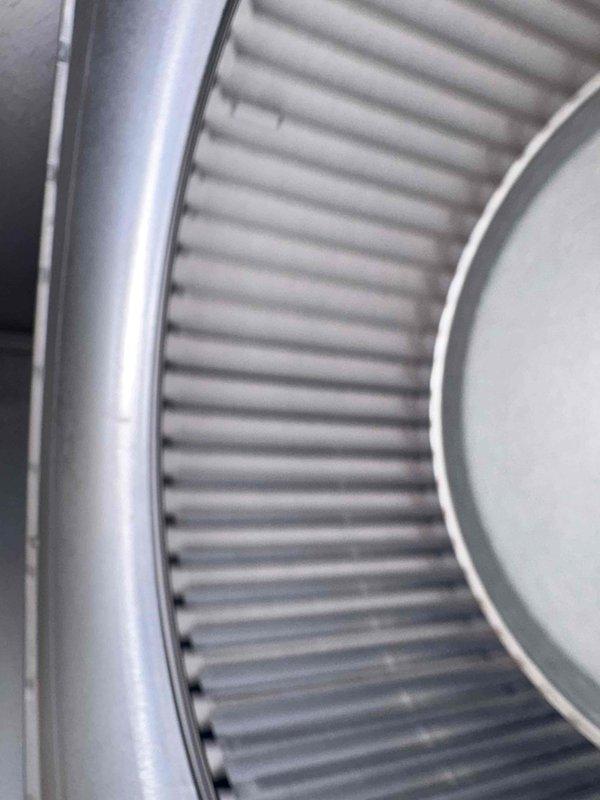 Completed scheduled cooling maintenance as part of annual commercial HVAC agreement (service 1 of 4). Replaced Aprilaire #410 cylindrical air filter with new pleated media element, inspecting filter housing for proper seal and fit. Performed comprehensive inspection of outdoor condenser unit, verifying fan operation, checking refrigerant line insulation integrity, and confirming adequate clearances around equipment on concrete pad.